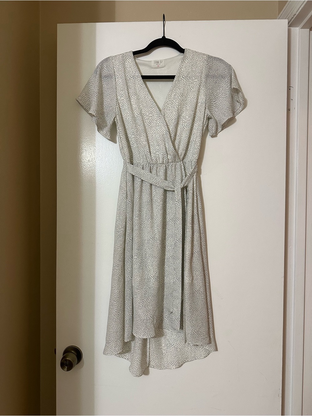 Sienna Sky White Wrap High-Low Dress with Subtle Dot Print